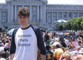 Asexuals Celebrate Inclusion, Diversity, And Self Determination Man wearing a T-shirt celebrating asexuality.