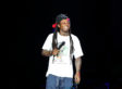 Lil Wayne Officiated a Gay Marriage During Jail Stint A photo of Lil Wayne performing on stage.