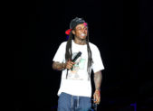Lil Wayne Officiated a Gay Marriage During Jail Stint A photo of Lil Wayne performing on stage.