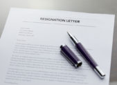 West Virginia Mayor Resigns After Racist Facebook Post Goes Viral A letter of resignation with a pen on top of it.