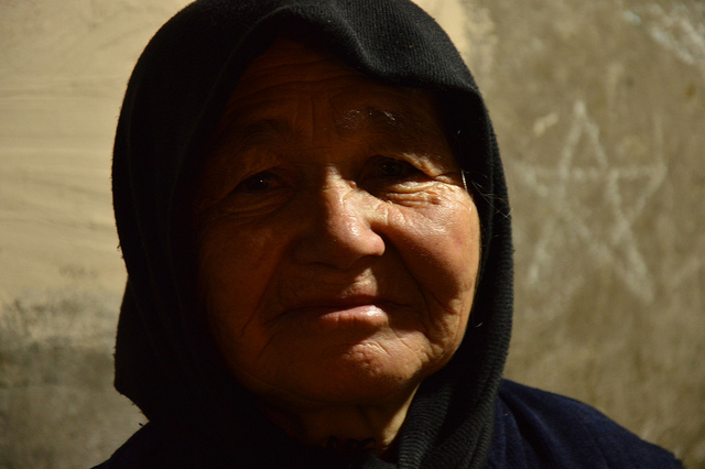 An elderly refugee woman from Afghanistan.