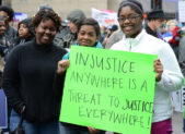 Gay Men Don’t Get a Free Pass to Mistreat Women A photo of three women holding a sign that reads, "injustice anywhere is a threat to justice everywhere!"