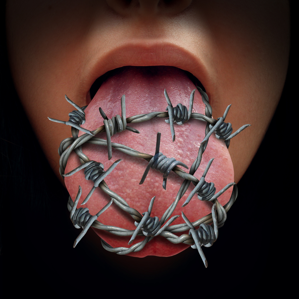An image of a tongue with barbed wire around it.
