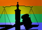 Kimberly Hively Wins Historic LGBT Civil Rights Case The silhouette of a gavel and the scales of justice juxtaposed against a rainbow background.