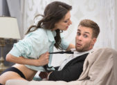 Female Led Relationships Are the Latest Craze. Here’s Why. A beautiful brunette woman straddles a man in an aggressive manner.