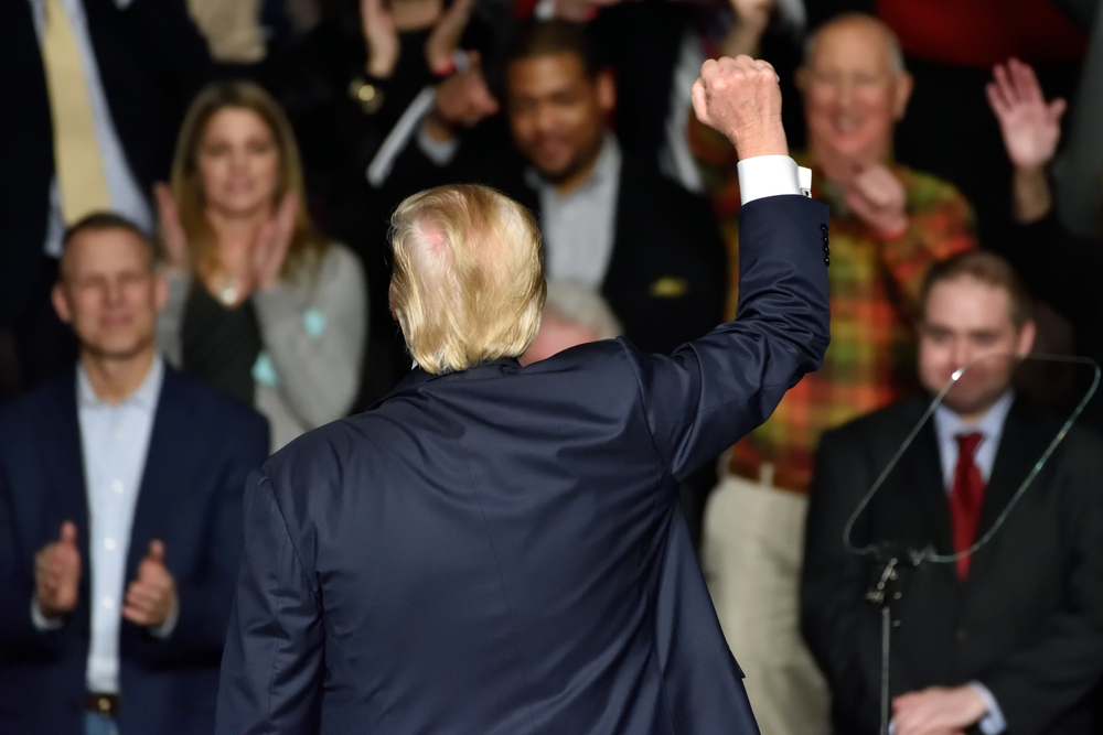 Donald Trump shown from the back.