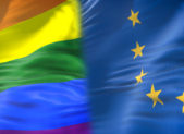 EU’s Top Court Backs Residency Rights for Gay Couples A rainbow flag placed next to the E.U. flag.