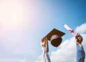 Abandoned By His Parents, Gay Valedictorian Defies All Odds A high school graduate raises his cap and diploma in celebration.