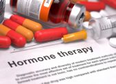 Wisconsin Insurance Will Cover State Workers Seeking Transgender Treatment A sheet of paper that's titled "Hormone Therapy." It is pictured alongside pills and a syringe.