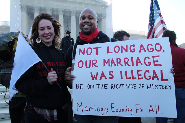 Lyssa and Kris show their support for same-sex marriage at a Marriage Equality Rally at the US Supreme Court, March 26, 2013.