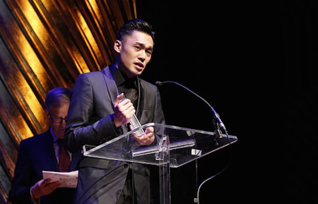 Nicholas Wong accepts the Lambda Literary Award for his collection of gay poetry, “Crevasse,” published by Kaya Press.
